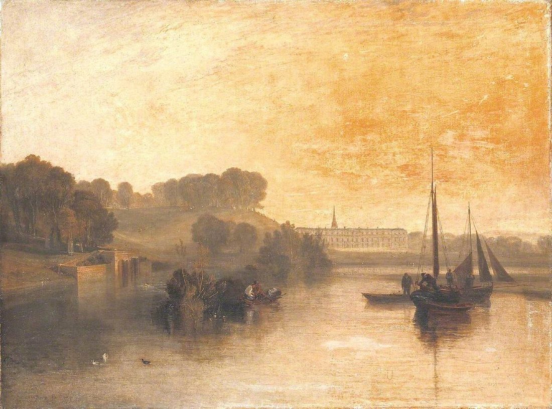 A country house across a lake in early light, mist over the water and deer on the near bank.